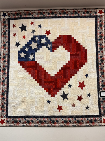 Quilts of Valor display at the library. This quilts have been made and given to military veterans for their service.